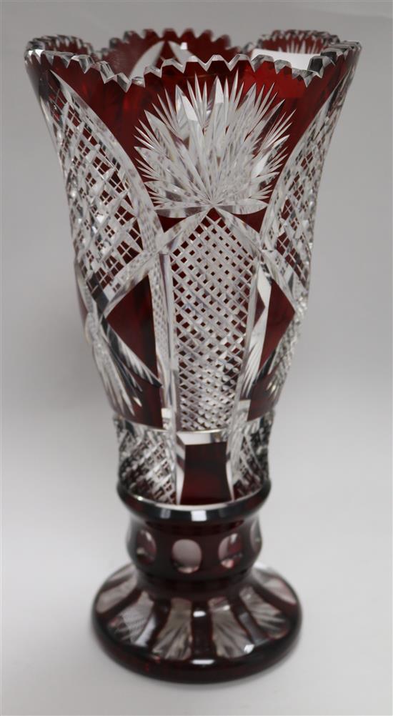 A Bohemian ruby overlaid cut glass vase 32cm